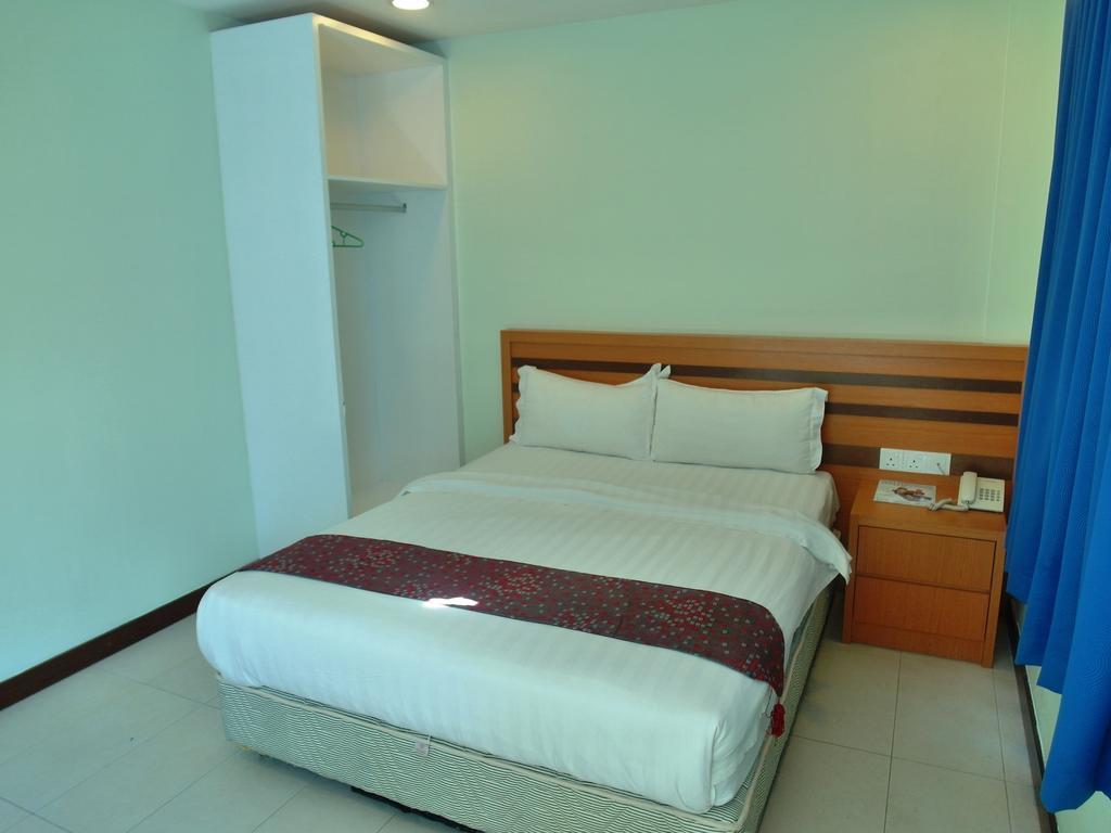 Transit Hotel Лабуан Номер фото